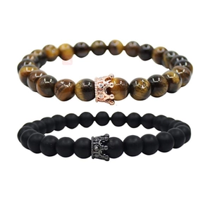 Close-up of crown beaded bracelets with tiger eye stones and matte black agate beads