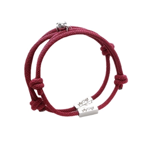 Matching magnetic red braided bracelets with custom engraved steel plates for couples