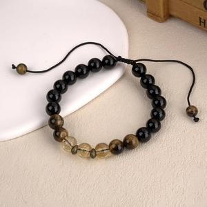 Retro energy beaded bracelet featuring yellow citrine, tiger eye, and black obsidian beads