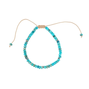 Detail of natural turquoise beaded bracelet with adjustable khaki woven rope and metal spacers