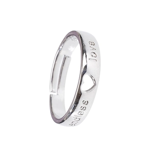 Macro detail of Endless Love engraving and heart cutout on silver adjustable ring
