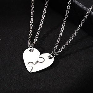 Polished titanium steel puzzle heart necklace set for couples on black jewelry box