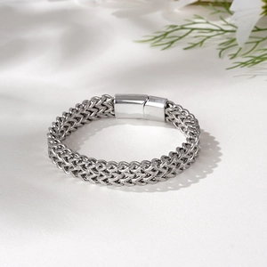 Close-up of silver wheat chain stainless steel bracelet with magnetic rectangular clasp