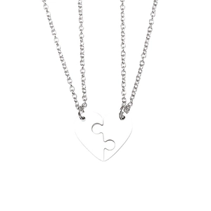 Polished titanium steel puzzle heart necklace set for couples on white background