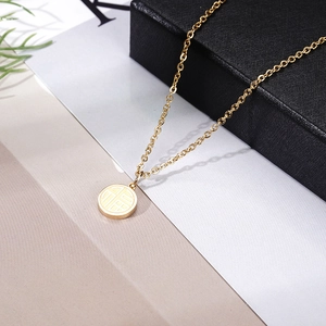 Detail of 18K gold-plated titanium necklace with hollow Fu character pendant design