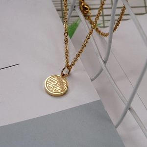 Close-up of 18K gold plated titanium necklace with traditional Chinese Xi character