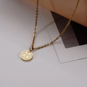 Detailed macro view of 18K gold plated titanium necklace with hollow Fu Xi pendant