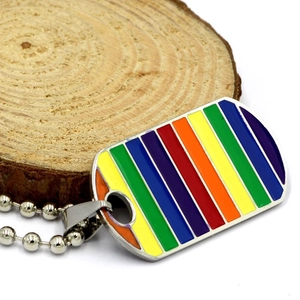 Detailed close-up of rainbow striped metal dog tag pendant on a silver bead chain
