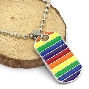 Rainbow striped dog tag pendant necklace made of stainless steel on wooden background