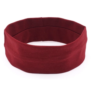 Elastic burgundy sports headband for yoga and fitness training in a solid color design
