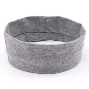 Close-up of deep gray elastic knitted sports headband with soft waffle texture