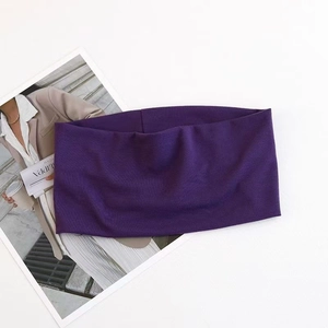 Detail view of seamless deep purple elastic yoga headband with premium knit texture