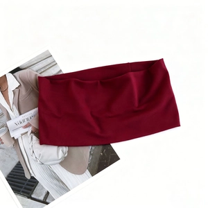 Macro view of wine red elastic sports headband with soft knit texture on white background
