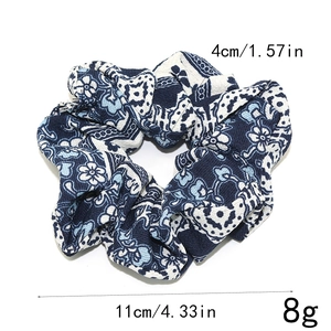 Ethnic style floral scrunchie in navy and beige fabric with 11cm outer diameter