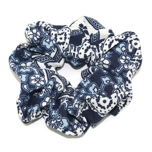 Floral fabric hair scrunchie with blue and white vintage pattern and elastic ruffles
