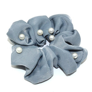 Elegant grey satin scrunchie with white pearl embellishments and pleated fabric design