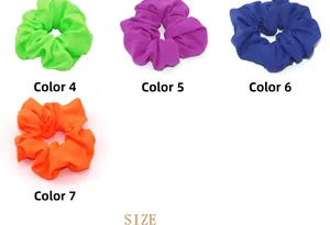 Detail view of four vibrant elastic scrunchies in neon green, purple, blue, and orange