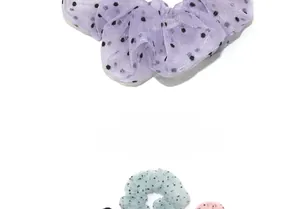 Detailed view of pastel polka dot tulle scrunchies in lavender, mint and pink colors