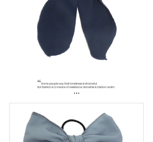Detail of elegant navy and dusty blue chiffon bow hair ties with elastic bands