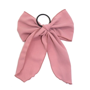 Dusty pink bow hair scrunchie with long streaming ribbons and durable elastic band