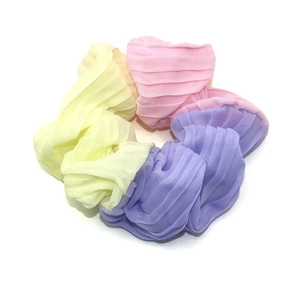 Three-color pastel chiffon scrunchie with yellow, pink, and purple pleated fabric texture