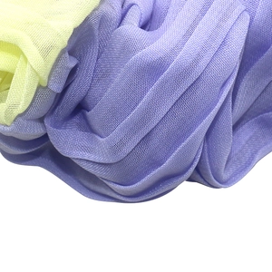 Pastel yellow and purple chiffon hair scrunchie with soft mesh texture and pleated design