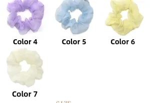 Detail of four organza scrunchies in pastel colors with subtle glitter finish