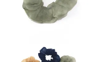 Detailed shot of translucent organza scrunchies with glitter finish in green and blue