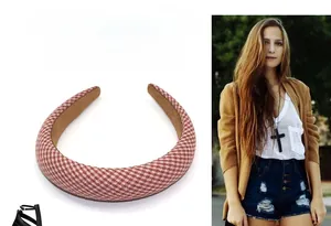 Detail of red and white gingham headband featuring thick sponge padding and fabric texture