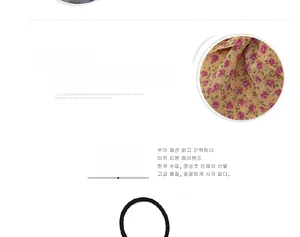 Detail of floral chiffon fabric accessory with elastic black hair tie for women