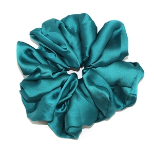 Teal satin scrunchie with large oversized design and silky glossy pleated texture