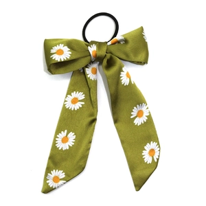 Green silk bow scrunchie with daisy print and long ribbons for elegant hair styling