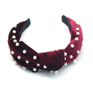 Elegant burgundy velvet headband with white faux pearls and a classic knotted design for women