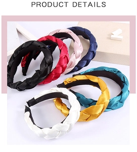 Close-up of braided silk satin headbands in multiple colors with non-slip lining details