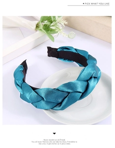 Detailed view of the lake blue braided satin headband showing woven silk texture and sheen