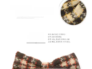 Macro detail of plaid fabric texture and pattern on the bow-shaped hair clip accessory