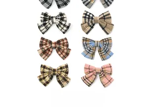 Detailed collection of vintage plaid bow hair clips in various classic color patterns