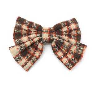 Vintage plaid bow hair clip featuring classic brown and orange woven patterns for autumn