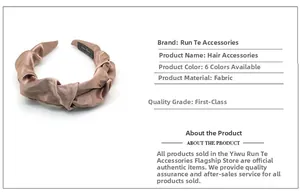 Detail of pleated satin knot headband in champagne gold with elegant silk-like texture