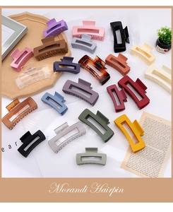 Detailed view of hollow rectangular hair claws in various Morandi and tortoiseshell colors