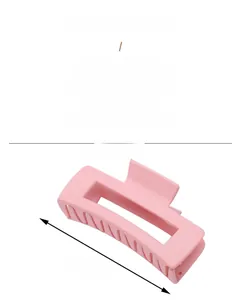 Detail showing 10cm pink acrylic hair claw clip with rectangular hollow design