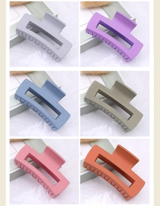 Detailed view of matte large square hair claws in six Morandi colors for thick hair