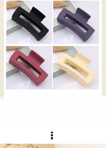 Detailed view of matte square hair claw clips in black, purple, burgundy, and yellow