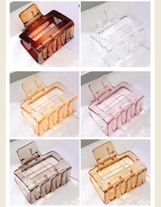 Detail view of six colorful hollow square hair claws in translucent acrylic finishes