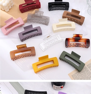 Macro shot of large rectangular hair claws in various matte and tortoiseshell finishes