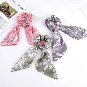 Three vintage French style paisley pattern scrunchies with long ribbons in pastel colors