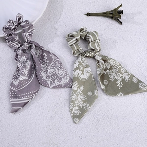 French vintage ribbon scrunchies with floral paisley patterns in purple and green