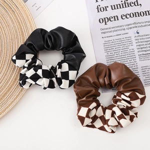 Fashionable checkerboard and faux leather scrunchies set in black and brown colors