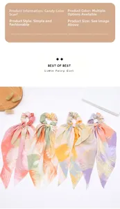 Close-up of four colorful tie-dye scrunchies with ribbons on a minimalist white tray
