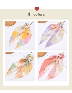 Detail of four colorful bohemian print scrunchies with long streamers in a grid layout